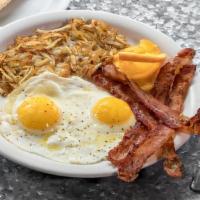 Eggs Breakfast · Two eggs any style with toast, rice, or hash browns with bacon or sausage.  Make it vegan wi...