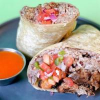 Island Jerk Chicken Burrito · Island-inspired jerk chicken burrito with your choice of toppings and sauce.