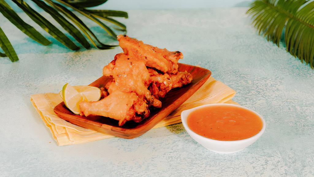 Pineapple Spiced Wings · Pineapple-chili chicken wings served alongside your choice of 2 sides and 1 sauce.