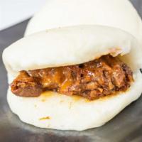 Kakuni Bao · Two steamed buns, chopped slow braised niman ranch pork belly, cucumbers, house bao sauce.
