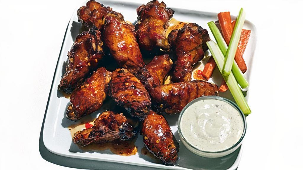 Oven-Roasted Wings · Double-baked for a crispy and flavorful wing without the use of a fryer or added oils. Hand-tossed in your choice of sauce: hot, mild, BBQ, jerk, sweet Thai chili or naked. Served with celery, carrots and your choice of ranch or bleu cheese dressing.