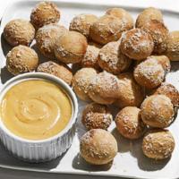 Pretzel Bites · Oven-baked and tossed in garlic butter and Parmesan.  Served with Pabst Blue Ribbon™ beer ch...