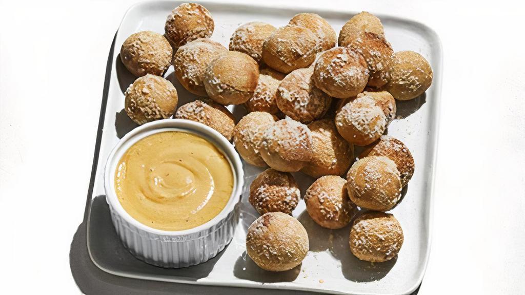 Pretzel Bites · Oven-baked and tossed in garlic butter and Parmesan.  Served with Pabst Blue Ribbon™ beer cheese.