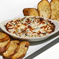 Spinach Artichoke Dip · A rich blend of five cheeses baked with spinach and artichokes.  Served with garlic toast po...