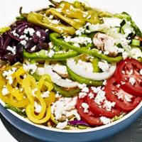 Greek Salad · Romaine and iceberg lettuce tossed with shredded carrots and red cabbage. Topped with sweet ...