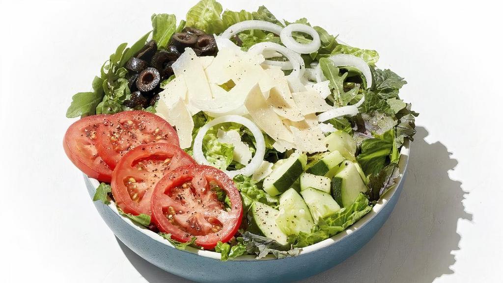 House Salad · A medley of fresh greens mixed with freshly chopped Romaine topped with Roma tomatoes, cucumbers, black olives, sweet onions and shaved Parmesan.