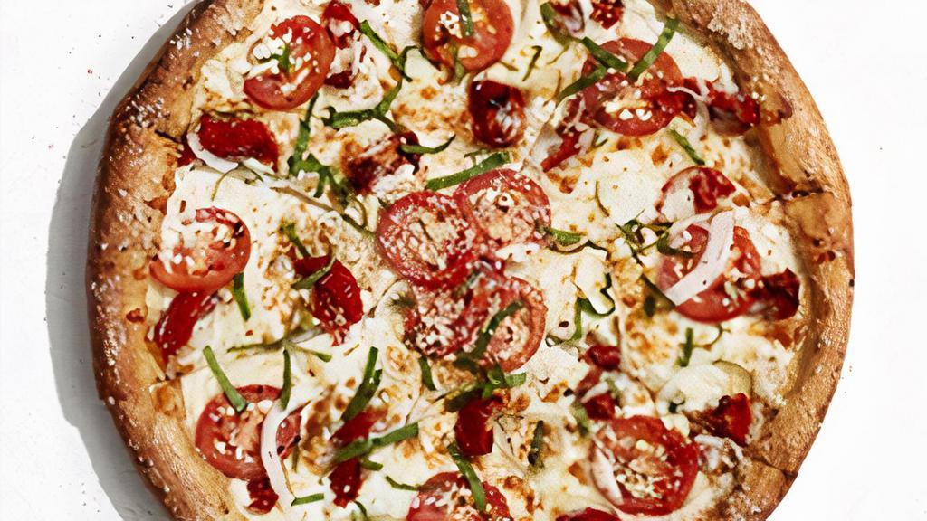 Great White · An olive oil and garlic base layered with mozzarella, provolone, seasoned ricotta, roasted tomatoes, authentic sheep’s milk feta cheese, fresh Roma tomatoes and sweet onions. Finished with chopped fresh basil.
