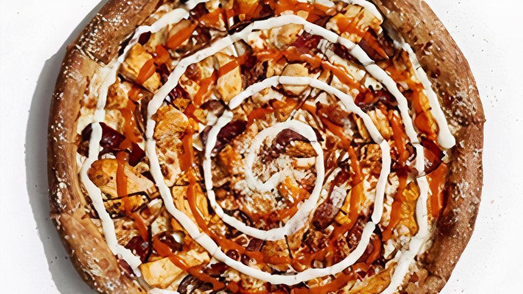 Buffalo Chicken · Made with mozzarella, then layered with Buffalo chicken, caramelized onions and applewood-smoked bacon. Finished with a double swirl of Buffalo sauce and your choice of chunky bleu cheese or ranch dressing..