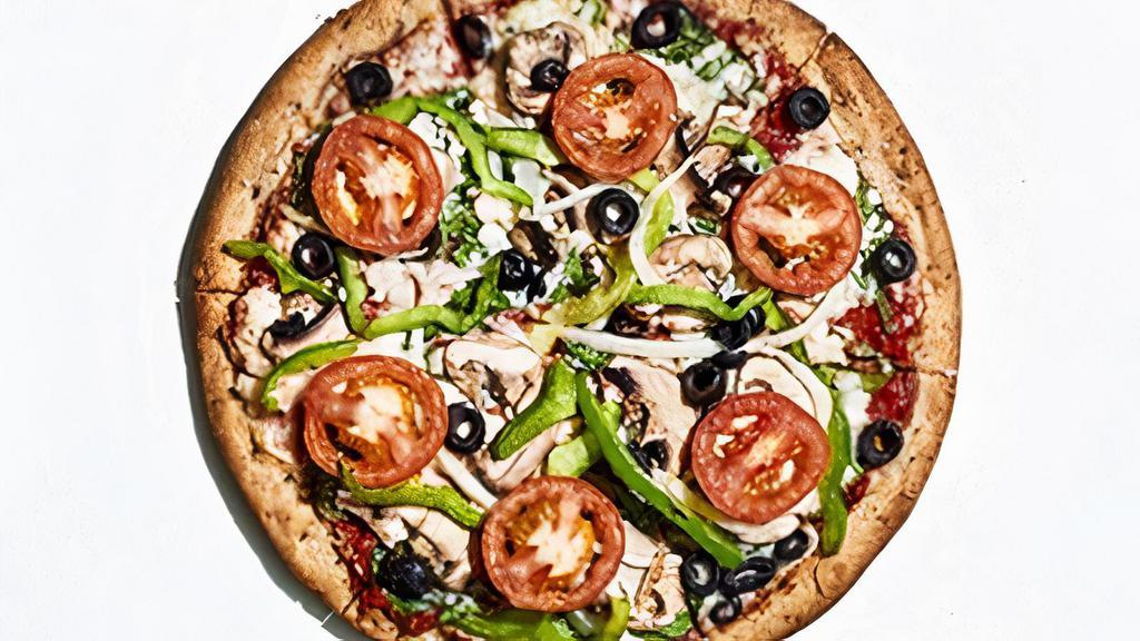 Vegan Veg-Out · This pie starts with Mellow red sauce layered with Follow Your Heart vegan cheese, spinach, green peppers, sliced mushrooms, sweet onions, black olives and Roma tomatoes. We have removed the butter and Parmesan finish.