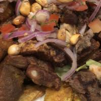 Picada De Carne  (Pequeño) · Carne asada, pollo, chicharron, chorizo, chuleta, tostones. 
Grilled Beef, Sausage, Pork cho...
