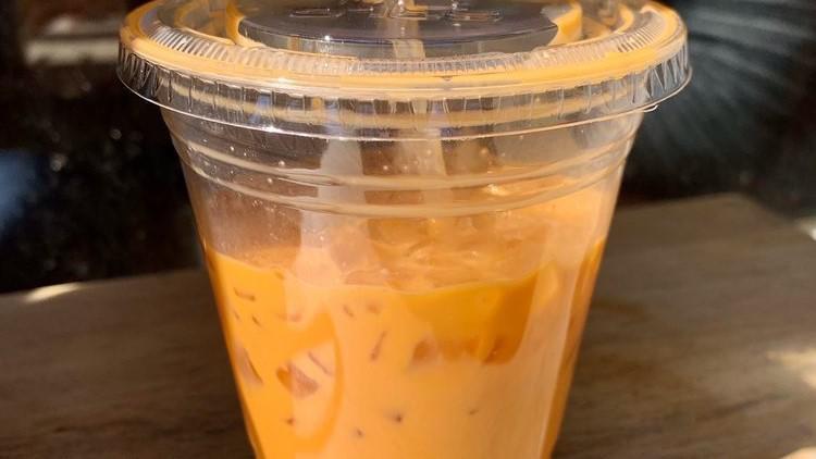 Thai Iced Tea · Brewed with real Thai tea leaves, infused with star anise and cloves, and sweetened condensed milk.