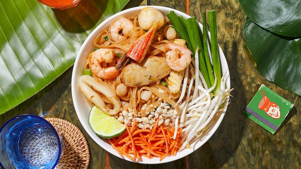 Seafood Pad Thai · Stir-fried rice noodles with shrimp, scallops, squid, scallions, bean sprouts, scrambled egg, and crushed peanuts.