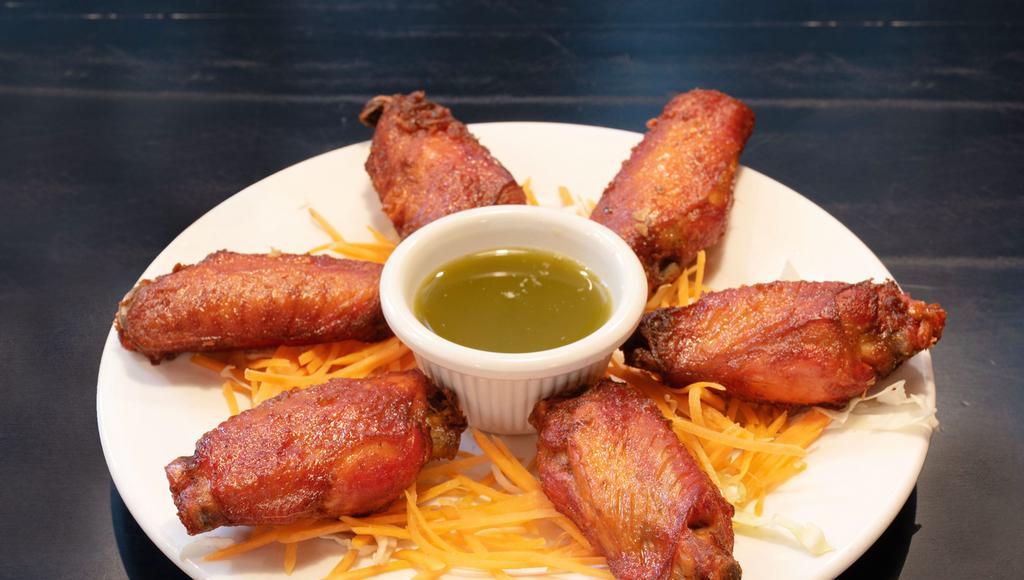Fried Spicy Chicken Wings · Wings marinated in fine spices and fried. Hot and spicy.