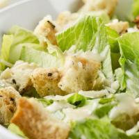 Classic Chopped Caesar Salad · Romaine chopped, croutons, Caesar dressing, shaved Parmesan cheese.