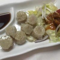 Shrimp Dumplings · Served with house ginger garlic dipping sauce.