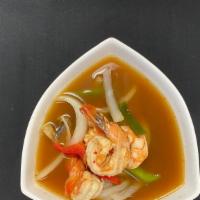 Large Tom Yum Koong (Shrimp) · Hot and sour soup with shrimp, lemongrass, lime juice, mushrooms, bell peppers, onions, scal...