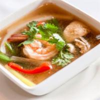 Small Tom Yum Koong (Shrimp) · Hot and sour soup with shrimp, lemongrass, lime juice, mushrooms, bell peppers, onions, scal...