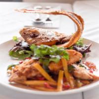 Mango Snapper · Filet red snapper topped with sweet and sour mango sauce with bell pepper, mango, and Thai b...