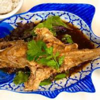 Pla Som Loot · A deep-fried fillet or whole fish topped with fresh chili, garlic, and tamarind in chef's sp...