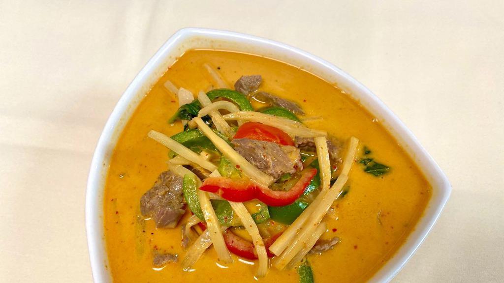 Gang Dang (Red Curry) · Red curry and coconut milk with bamboo shoots, bell peppers, onions, lime leaves, and basil leaves.