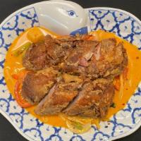 Gang Pad Yang (Duck) · Roasted duck in red curry sauce and coconut milk with bamboo shoots, onions, bell peppers, t...