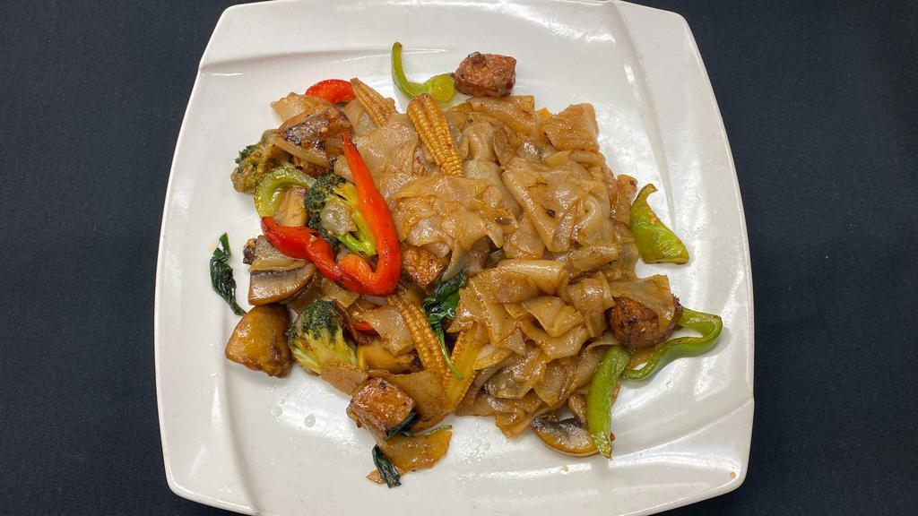 Vegetables Kee Mao (Drunken Noodle) · Sautéed vegetables and tofu with broad rice noodles basil leaves, onions, mushrooms, bell peppers, and hot and spicy chili paste.