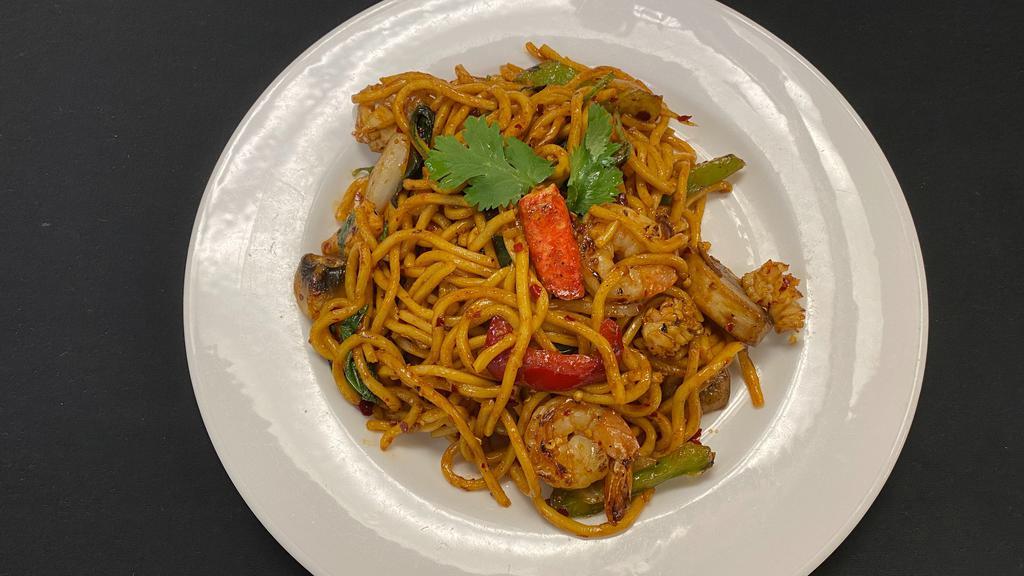 Seafood Dry Noodles · Sautéed egg noodles with shrimp, squid, and crabmeat stick, bell peppers, mushrooms, onions, and Thai basil in spicy chili sauce.