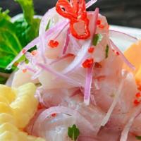 Ceviche De Pescado · Marinated fish with lime juice, curdled red onions & cilantro