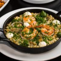 Arroz Vasco · Bomba rice, salted cod risotto, manila clams, shrimp, asparagus, parsley broth. (Gluten free...
