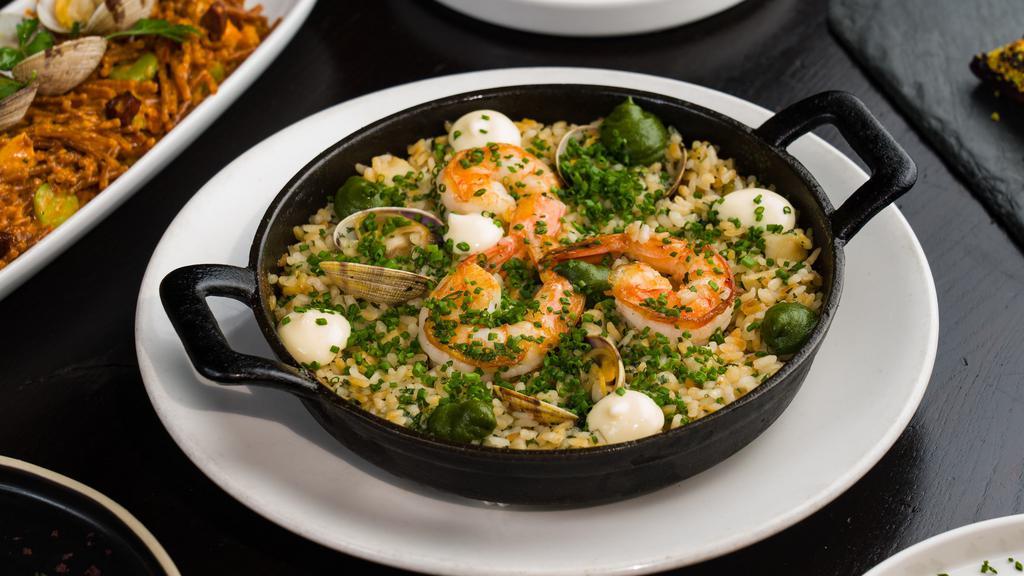 Arroz Vasco · Bomba rice, salted cod risotto, manila clams, shrimp, asparagus, parsley broth. (Gluten free, contains shellfish). *If you have any severe food allergies (I.E. Celiac disease), please contact the restaurant directly for further menu advisement.