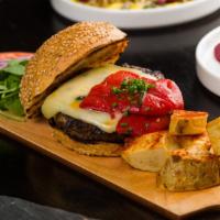 Hamburguesa Iberica · Grilled angus beef burger, melted Arzúa cheese, tomato confit, piquillo pepper, patatas brav...