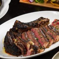 Chuleton · Grilled 2.2lb prime rib-eye steak on the bone (Pat LaFrieda), fingerling potatoes, spring on...