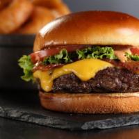 Classic Cheeseburger · Burger, lettuce, tomato, American cheese, bacon and house sauce.