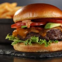 Club Burger · Spicy. Burger, bacon, cheddar cheese, avocado, lettuce, tomato and sriracha ranch dressing.