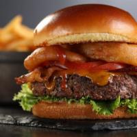 Bbq Burger · Burger, BBQ sauce, cheddar cheese, bacon, onion rings, lettuce and tomato.