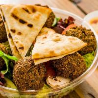 Falafel Salad · Vegetable patties served on top of mixed greens with hummus. Served with bread and choice of...