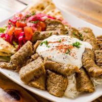 Gyro Plate · Mixture of beef and lamb marinated in herbs and spices served with mixed greens.