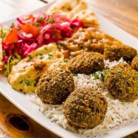 Falafel Plate · Falafels, served with rice, mixed greens, hummus and eggplant.