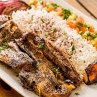 Lamb Chop Plate · Plates served on a bed of our seasonal long grain rice with bread and a side salad.