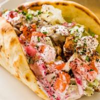 Chicken Pita Sandwich · Chunks of chicken breast marinated in special herbs and spices, broiled on a skewer. Served ...