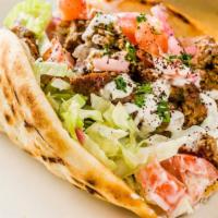 Kofta Pita Sandwich · Ground beef mixed with our house spices and peppers. Served in a pita with lettuce, tomatoes...