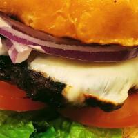 Lamb Burger · Ground lamb mixed with herbs and spices served with lettuces,tomatoes,onions, pickles and ch...