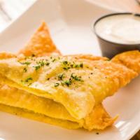 Bolani · Crispy turnovers stuffed with choice of chicken or mixed veggies.