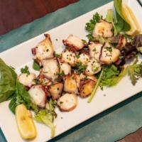 Grilled Octopus · Octopus is lightly grilled & dressed with lemon & olive oil.