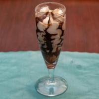 Hazelnut Truffle · A core of dark chocolate embraced by our velvery hazelnut gelato covered with praline hazeln...