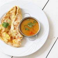 Roti Telur · Classic egg roti with onion and fresh green chili. Served with curry potato chicken sauce.