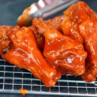 Buffalo Wings · Fresh all natural hormone-free chicken wings. Served with Bleu cheese and celery.