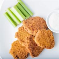 Buffalo Vegan Nuggets · Vegan nuggets tossed in choice of dry rub or sauce. Served with bleu cheese & celery.