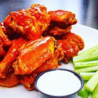 Value Meal #5 - 12 Buffalo Wings · Twelve Buffalo Wings with your choice of one side and a soda.