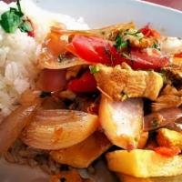 Lomo Saltado Mixto · Chicken & Beef stir fry with onions, tomato, cilantro served with a side of white rice.